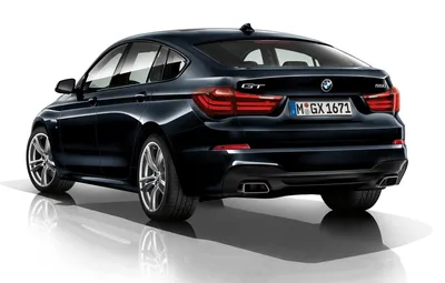 BMW M550i Gran Turismo 2023: фото в дождливую погоду