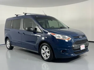 Фото Ford Transit Passenger Wagon 2023 на фоне заката