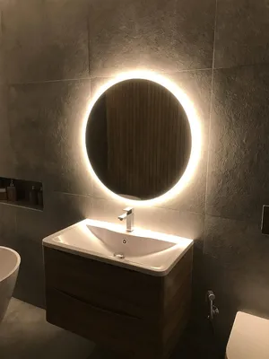 Арт фото круглого зеркала в ванной