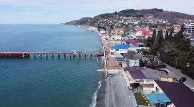 Фото Лоо города и пляжа: место, где сливаются небо и море