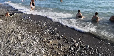 Фотографии Лоо города и пляжа: место, где сливаются солнце и вода