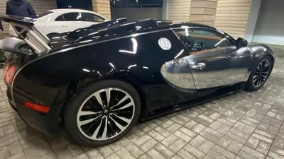 «Фото bugatti veyron на фоне города»