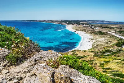 Погрузитесь в атмосферу пляжей Сардинии с помощью этих фото.