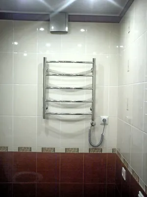 Фотография полотенцесушителя в ванной комнате