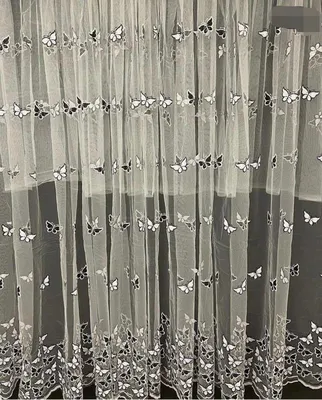 Фотографии тюльной ткани, украшенной разнообразными бабочками