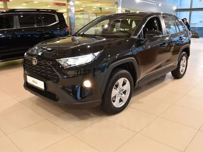 Фото Toyota RAV4 2023 с солнцем на фоне