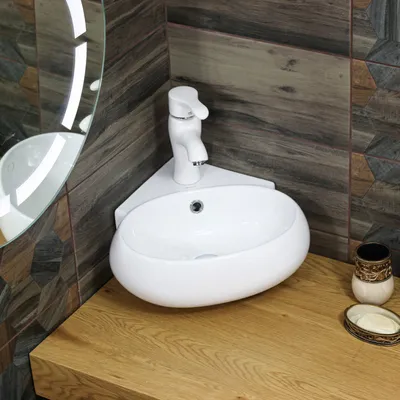 Функциональность и стиль: угловые раковины для ванной комнаты