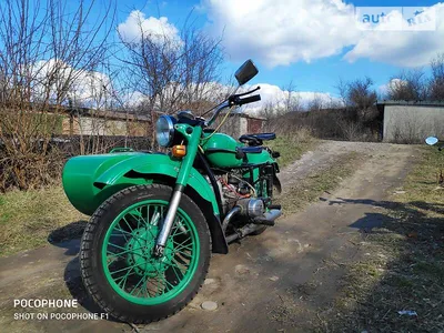 Фотография мотоцикла Урал на фоне горных вершин