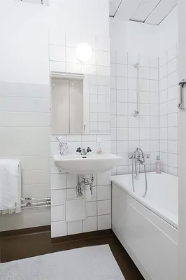 Фото ванной комнаты с белой плиткой - новое изображение